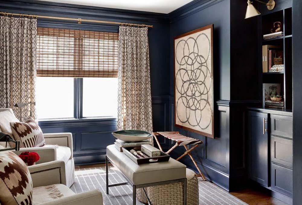 A living room with light beige furniture and curtains, painted with dark blue Benjamin Moore paint, available at Regal Paint Centers in MD & VA.