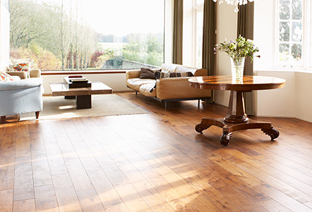 A living room with the floor finished using Benjamin Moore Lenmar Interior Stains, available at Regal Paint Centers in MD & VA.