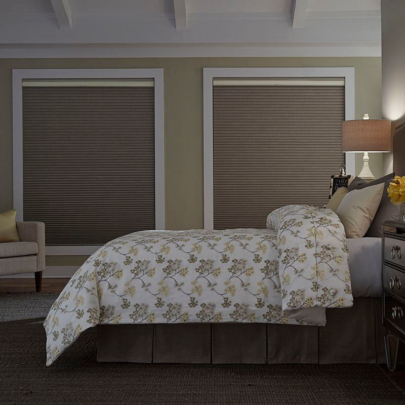 bedroom with green/beige walls and blackout shades for full light control from Regal Paint Centers