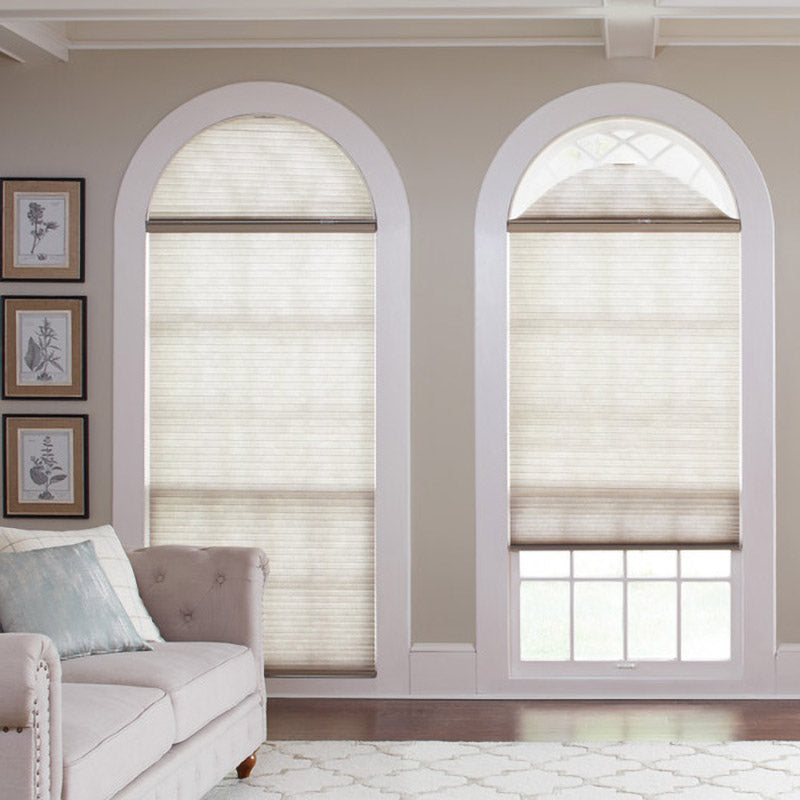 beige living room with custom arched windows and custom window coverings